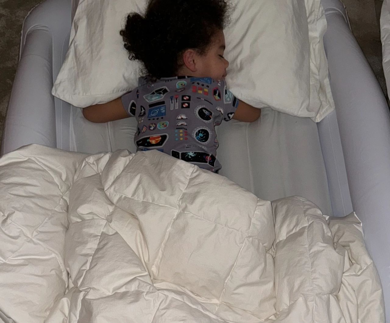 Kai sleeping on the Hiccapop Toddler Travel Bed